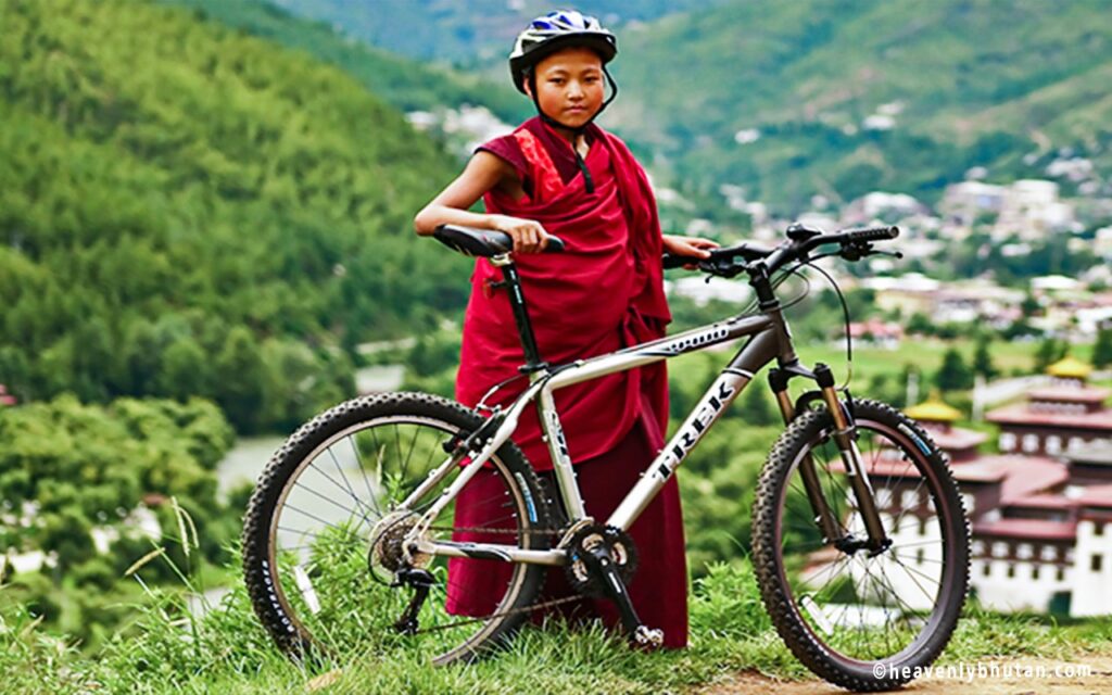 Projects travel bhutan on bike little monk on cycle